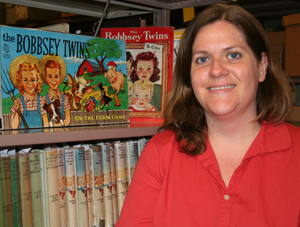 Danielle Culpepper with RBS's collection of Bobbsey twin series books