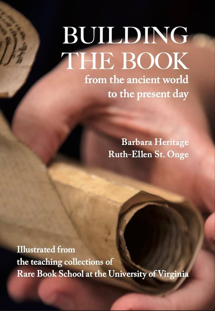Front cover of "Building the Book", with an image of a person's hand unrolling a scroll